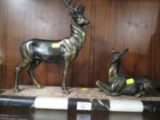 TWO BRONZE EFFECT DEER ON A MARBLE TYPE PLINTH A/F