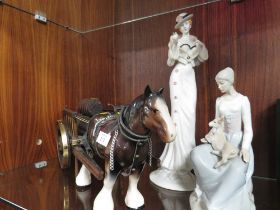 TWO FIGURINES TOGETHER WITH A MODEL OF A SHIRE HORSE AND DRAY (COMPLETE WITH BARRELS )