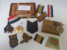 A WWI 1914 / 15 STAR TRIO, MARKED TO 91327 GNR F.J. LUNN RA, ALONG WITH A WWII DEFENCE MEDAL IN