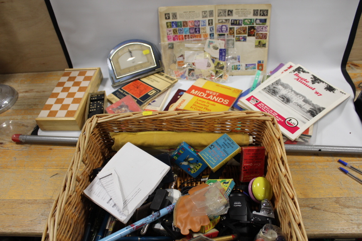 A BASKET OF ASSORTED COLLECTABLE TO INCLUDE A GAY VENTURE STAMP ALBUM AND CONTENTS