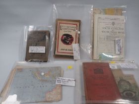 A QUANTITY OF PRESS SEAL FOLDERS CONTAINING WWII MANUALS, MAPS, RAMBLING BOOKS ETC