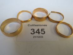 FOUR PLAIN 22CT GOLD WEDDING BANDS - APPROX W 11.1 G (ONE A/F), PLUS AN 9CT GOLD EXAMPLE - APPROX