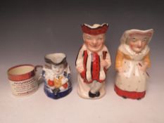 THREE ANTIQUE STAFFORDSHIRE TOBY JUGS, to include Punch and Judy, blue and white example and a