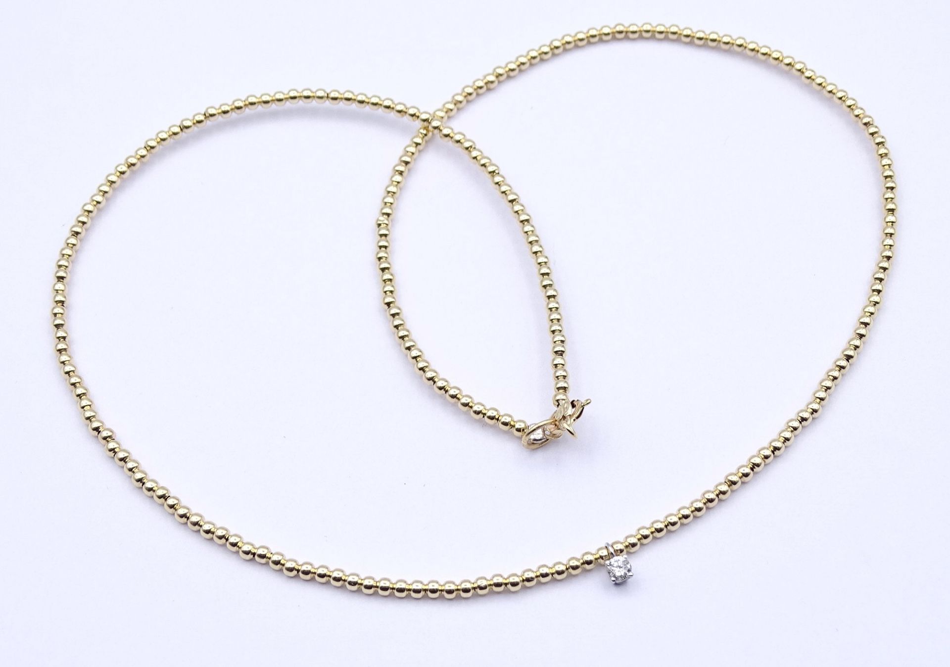 Halskette, GG 585/000 mit Diamant 0,07ct., L. 40,5cm, 1,45g.