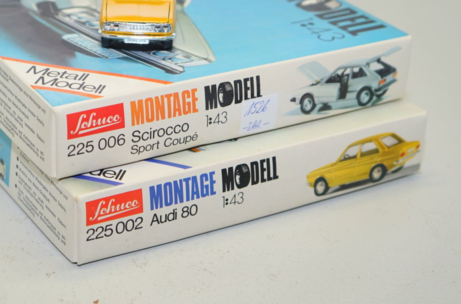 2x Schuco Montage-Modelle sowie 1x Audi 80-Modell, 1:43