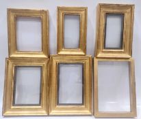 Six glazed gilt picture frames of composite construction.