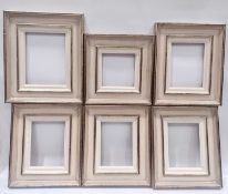 Six picture frames of composite construction.