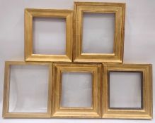 Five glazed picture frames of composite construction.