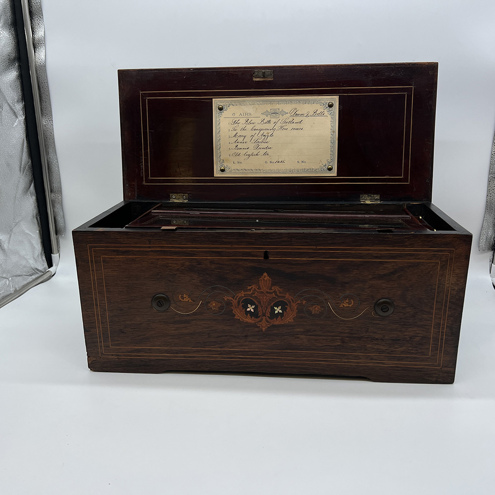 A mahogany 6 airs and drums and bells music box