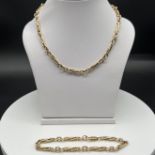 9ct yellow gold trumbone necklace and bracelet