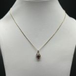 9ct yellow gold garnet and diamond pendant and chain