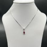 18ct white gold ruby and diamond pendant