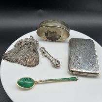 A silver case and other items