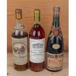 3 Flaschen: Super-Anjou 1957, Chateau Rabaud-Promis 1987 und Château Carbonnieux 1953