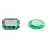 Two loose faceted emeralds weighing 1.50ct and 1.04ct respectively; the octagonal emerald-cut has an