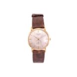 An 18ct gold Longines wristwatch, featuring a swiss made hand-wound movement caliber: 19.4 in a