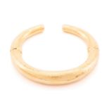 LALAoUNIS - a 'Neolithic' double-hinged bangle, from Greek designer Ilias Lalaounis, the hollow