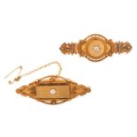 Two Etruscan Revival diamond-set brooches in 15ct gold; to include a Victorian brooch in navette