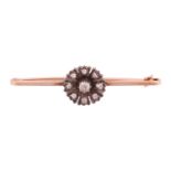 A diamond-set flowerhead bar brooch, in the form of a coreopsis flower, centred with an old-cut