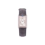 A Cartier Tank Basculante 2390, featuring a hand-wound swiss-made mechanical movement in a steel