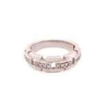 A 9ct white gold and diamond half hoop brick link ring, set with four set panels each set with