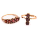 Two garnet rings, the first consists of three circular-cut garnets vertically set in a coronet