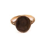 A George III intaglio ring, featuring an oval faceted quartz panel, depicting a profile of a