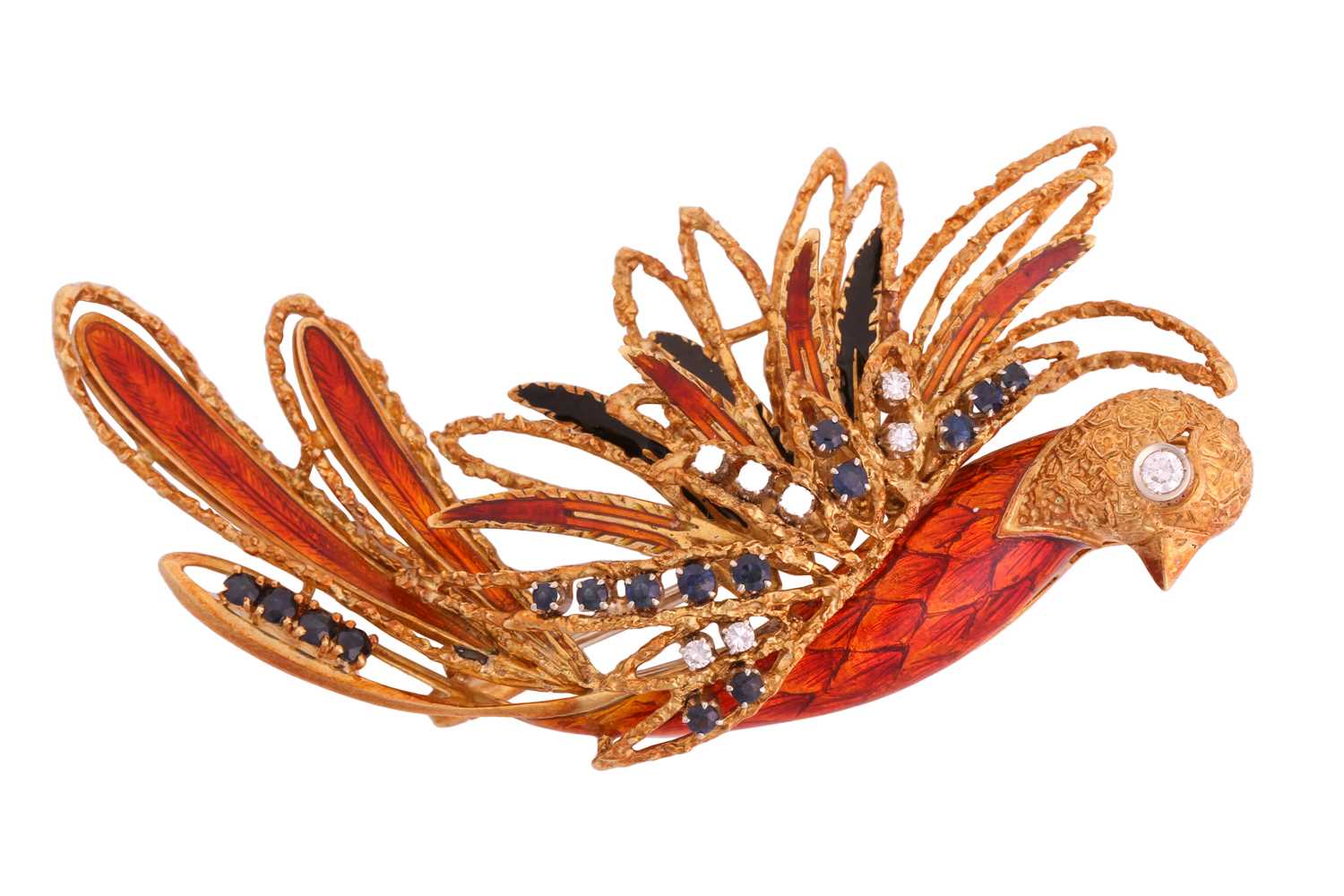 A sapphire and diamond phoenix brooch set in textured yellow metal with translucent orange enamel
