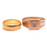 A 22ct gold wedding band and a 9ct gold signet ring; the wedding band is composed of a plain D-