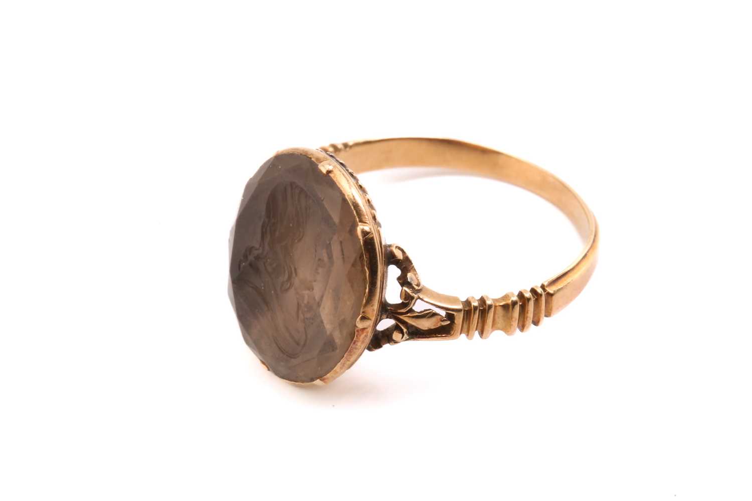 A George III intaglio ring, featuring an oval faceted quartz panel, depicting a profile of a - Image 2 of 5