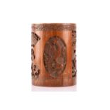 A large Chinese carved bamboo, brush pot, bitong 19th/ 20th century, with hook carved panels of