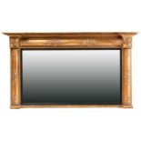 A Regency inverted breakfront giltwood overmantle mirror with turned split pilasters and frieze with