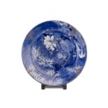 A Japanese blue and white circular porcelain charger, Meiji Period, late 19th century, decorated