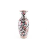 A Chinese Famille rose vase, early 20th century, painted with flowers against a black ground,