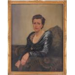 Early 20th-century British school, a half-length portrait of a lady in a blue dress, oil on