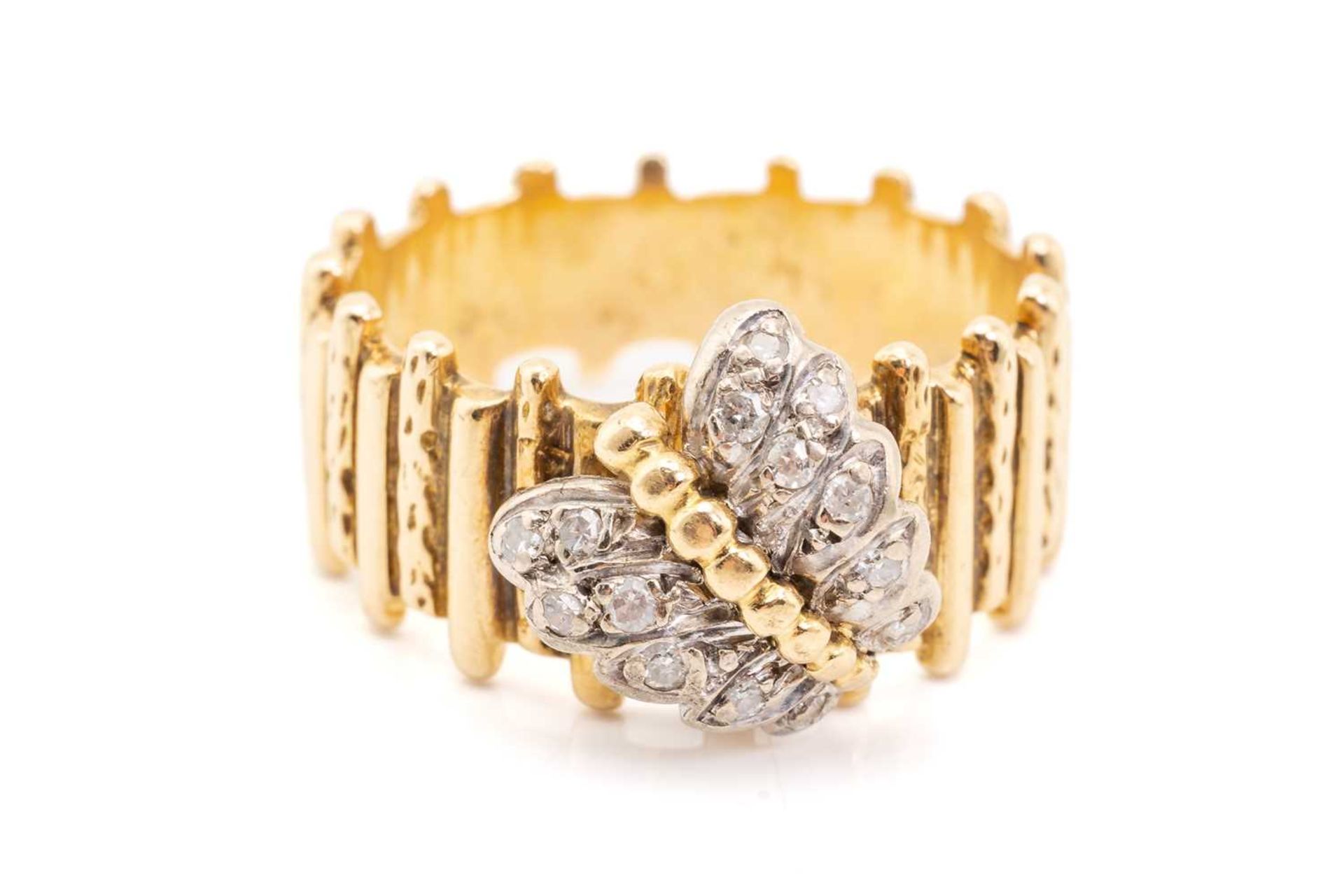 A yellow metal and diamond ring, designed with a diamond-set butterfly, with textured band, unmarked