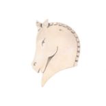 Georg Jensen - A brooch in the form of a stylised horsehead silhouette, fitted with hinged pin