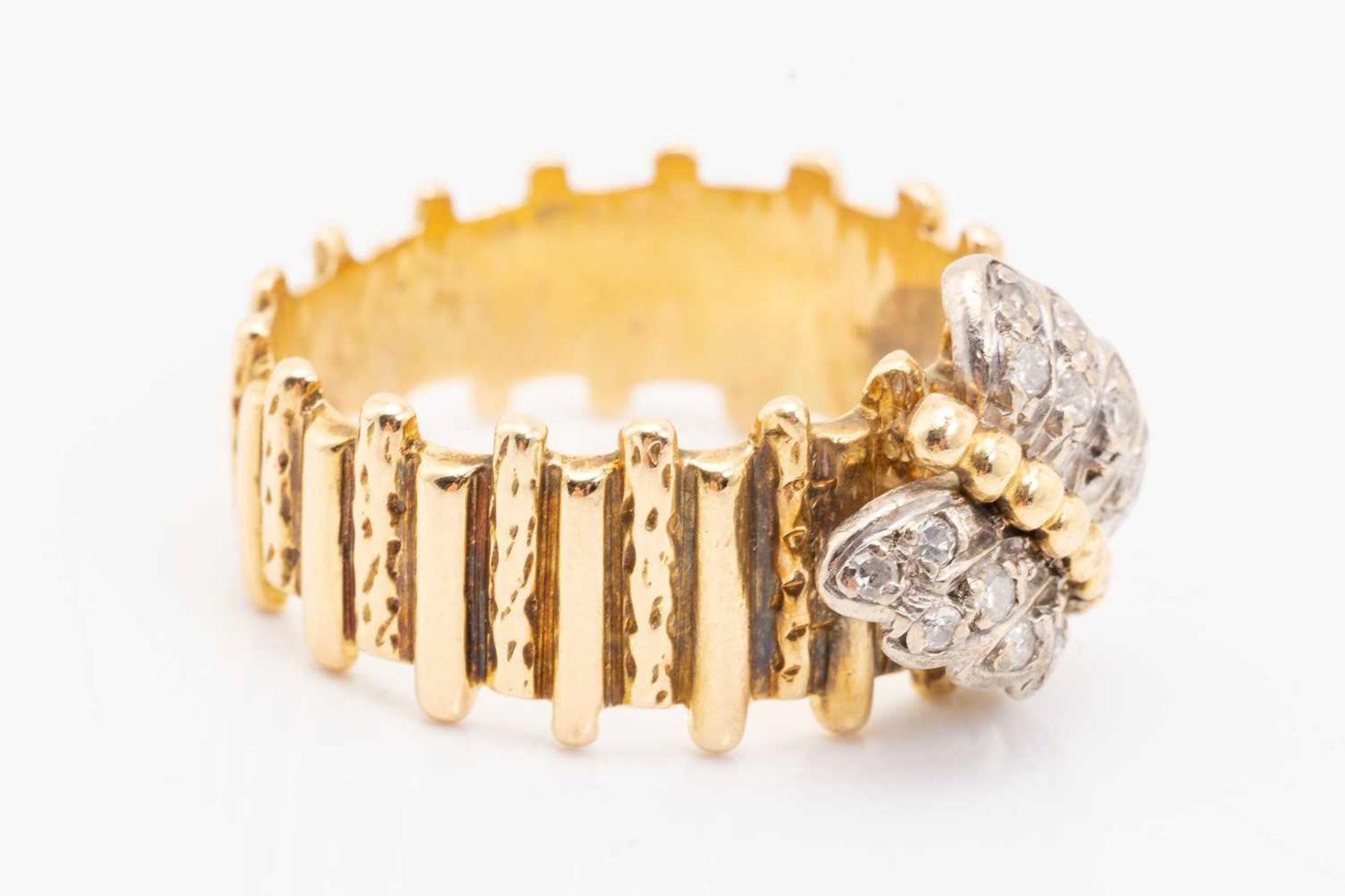 A yellow metal and diamond ring, designed with a diamond-set butterfly, with textured band, unmarked - Image 2 of 5
