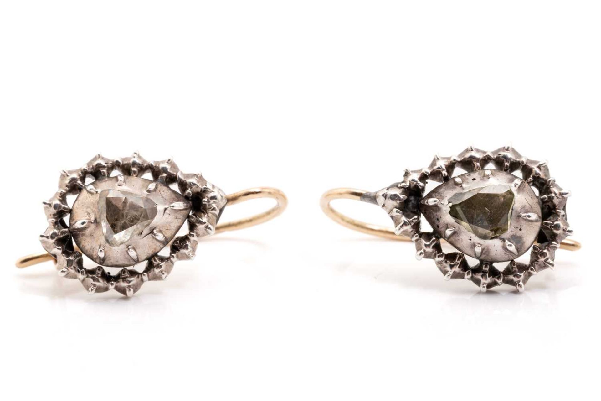 A pair of 19th-century diamond earrings, each encapsulating a pear-shaped rose-cut diamond in a - Image 2 of 4