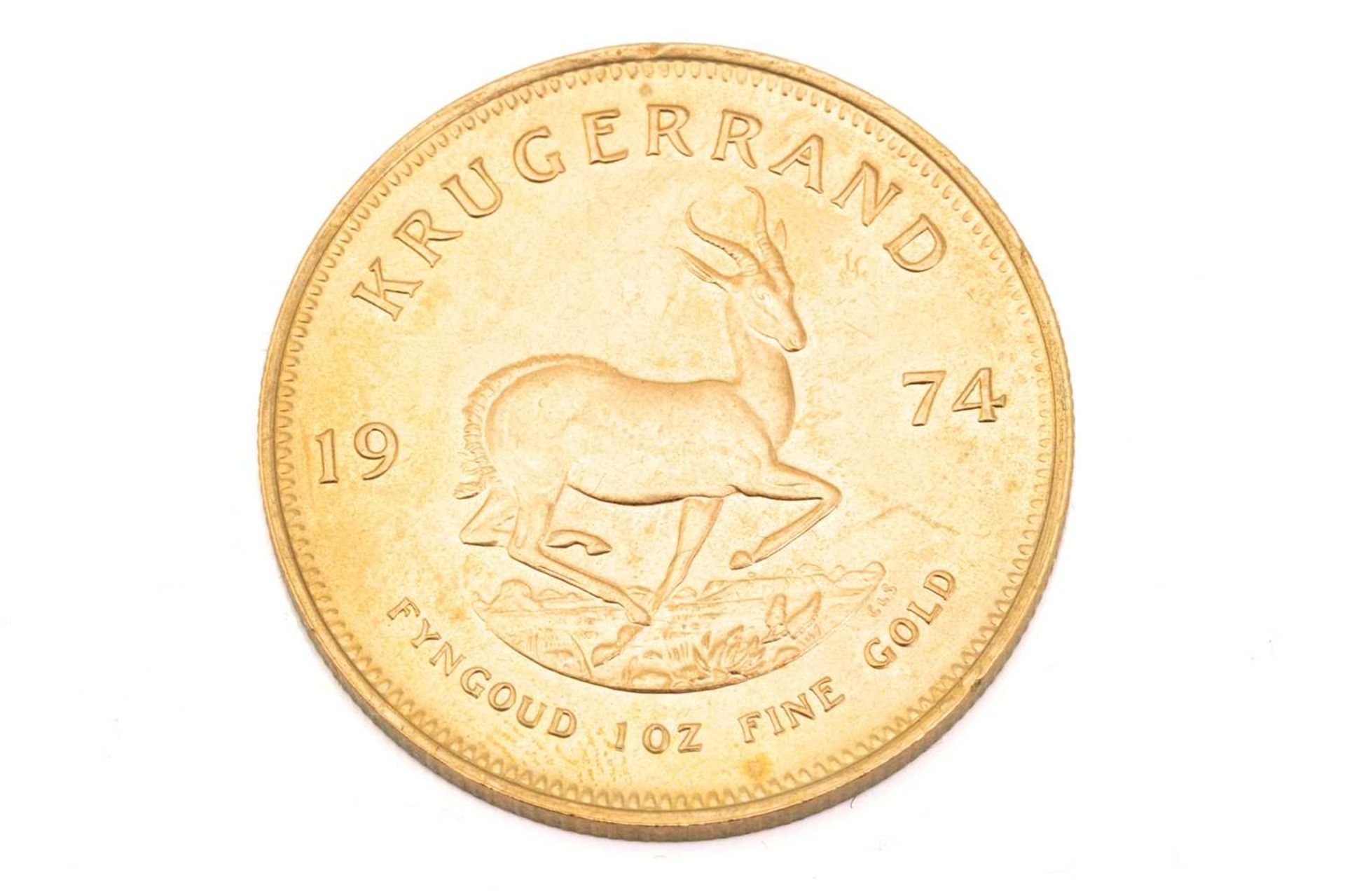 A 1oz 22ct gold South Africa Krugerrand, 1974Obv: light surface marks to bust. Rev: Some tiny edge - Image 3 of 3