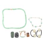 A collection of Chinese jewellery; including a jade ID bracelet, curved carved panel with auspicious