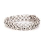 Theo Fennell. An 18ct white gold diamond-set slinky bracelet, comprising three rows of brilliant-cut