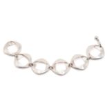 Georg Jensen - A bracelet with six oval-shaped links, connecting to a ball and chain clasp, designed