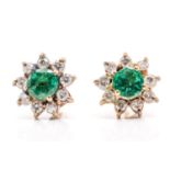A pair of yellow metal, emerald and diamond earrings, of floral cluster design, each set with a