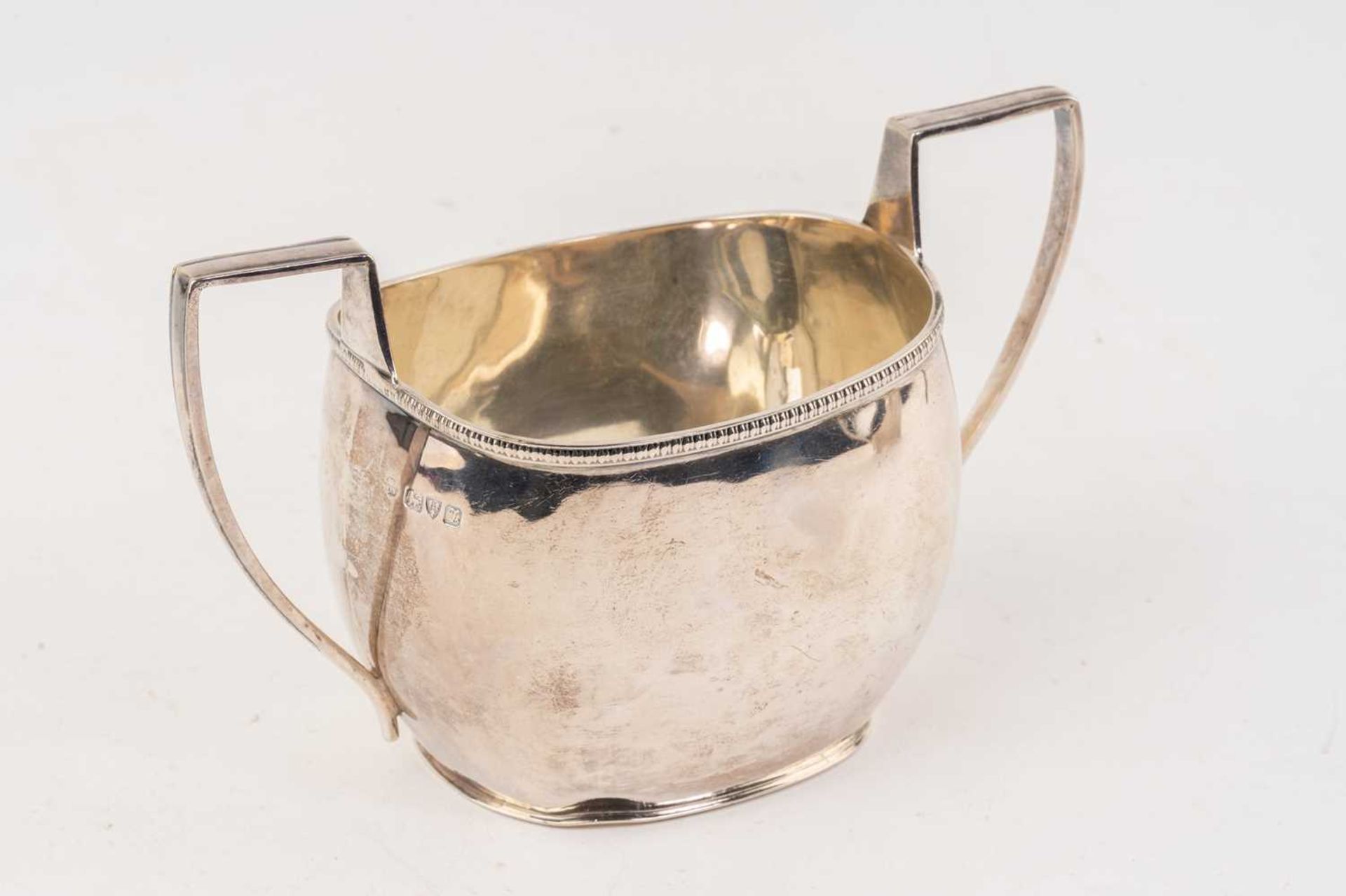 An early 20th-century three-piece silver tea set, Chester 1911 by Blackensee & Sons, comprising a - Image 6 of 10
