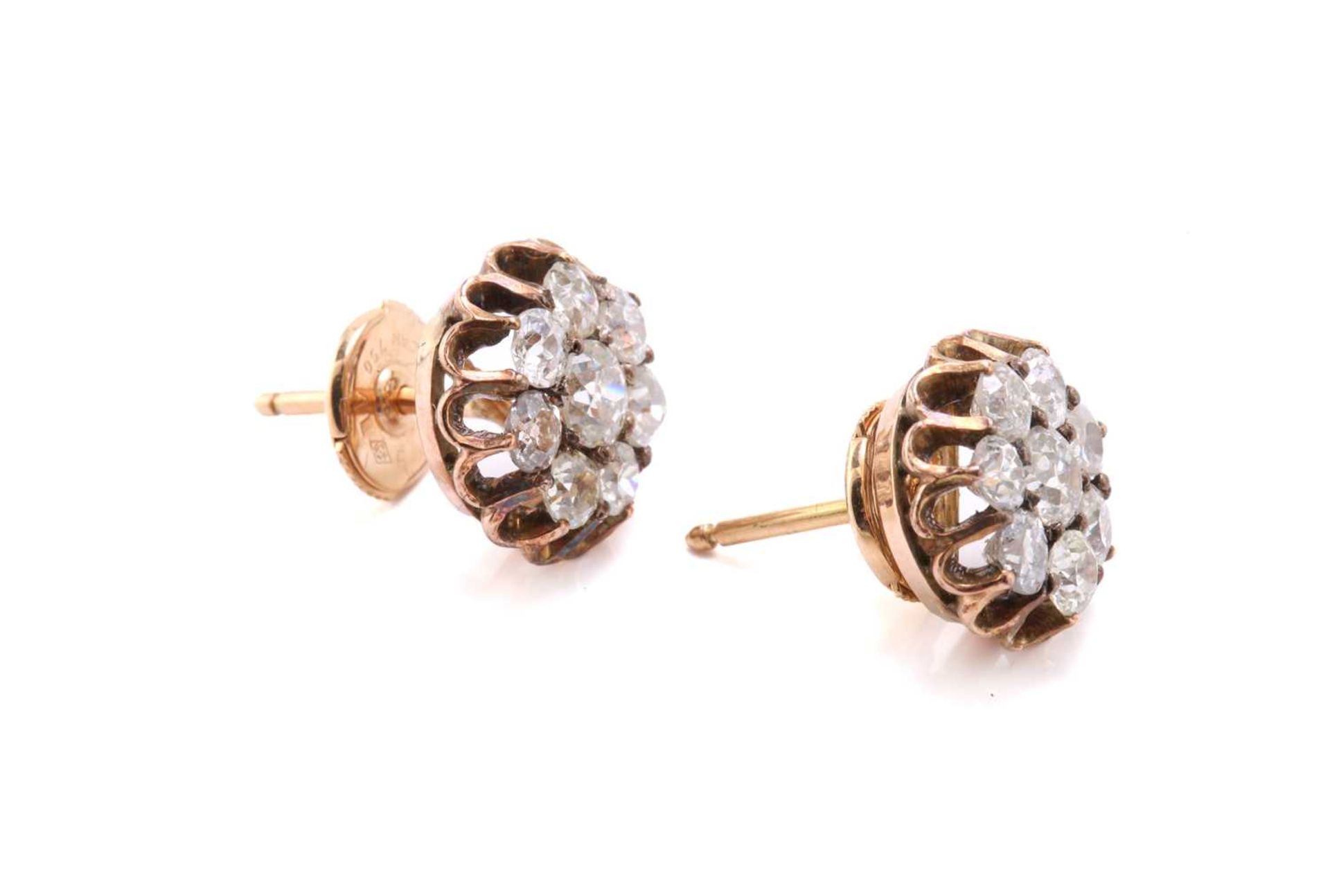 A pair of diamond cluster earrings, each composed of a circular old-cut centre diamond encompassed - Image 2 of 5