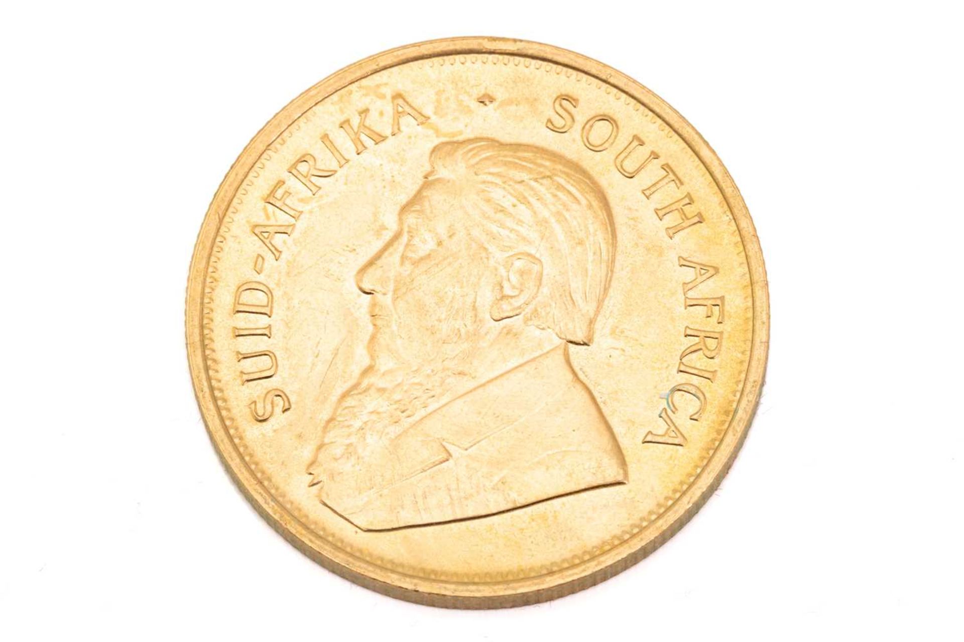 A 1oz 22ct gold South Africa Krugerrand, 1974Obv: light surface marks to bust. Rev: Some tiny edge - Image 2 of 3