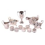 A small collection of silver; including a small Chester 1910 helmet cream jug with leaf-capped