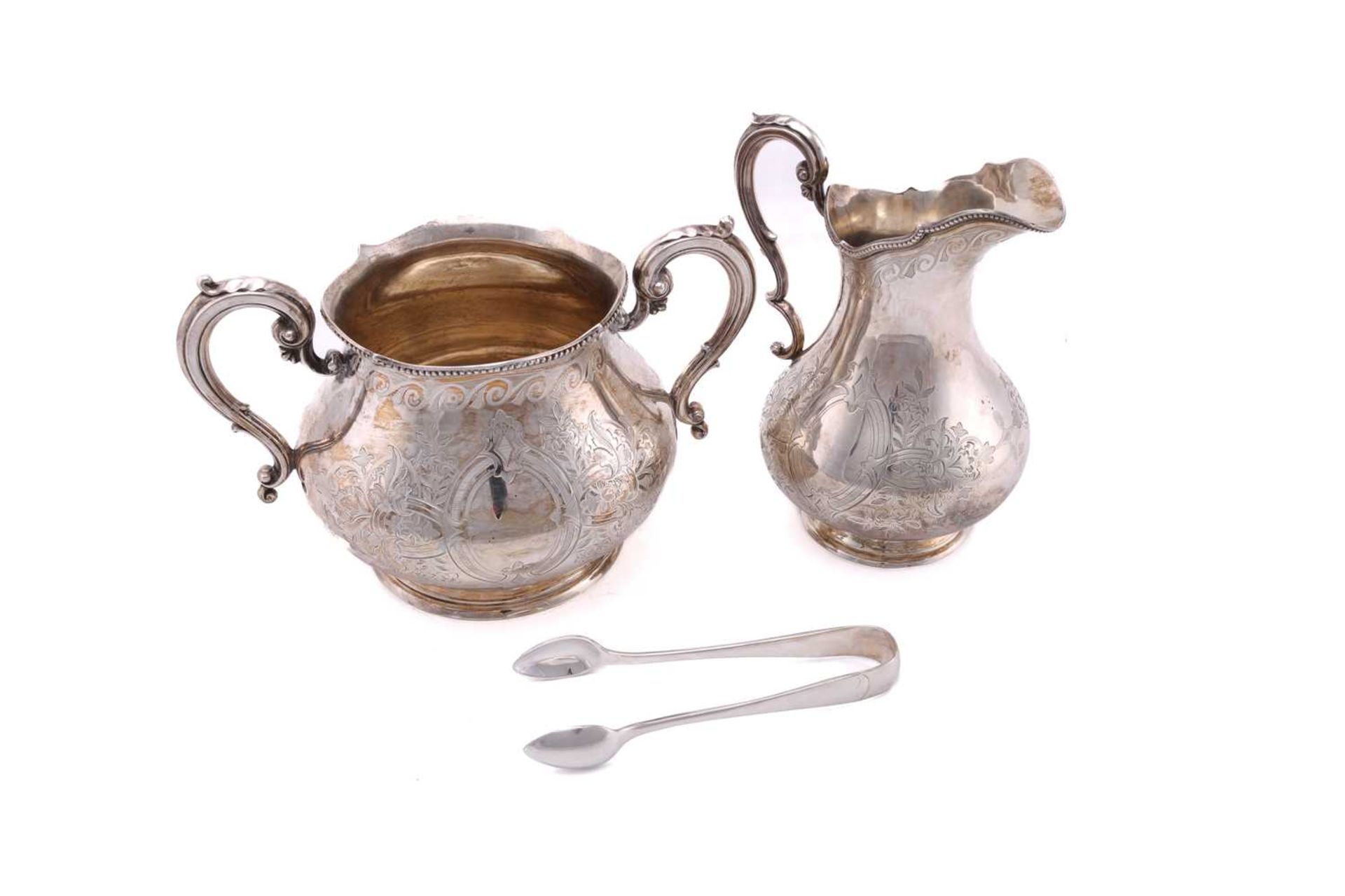 A Victorian silver three-piece tea service and sugar tongs of mixed date but the corresponding - Image 9 of 10