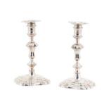 A matched pair of George II/III cast silver table candlesticks, London 1737, marked DE (maker not